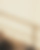 subtle-gradient-background-with-grainy-texture-blending-soft-beige-brown-tones-wallpaper-w
