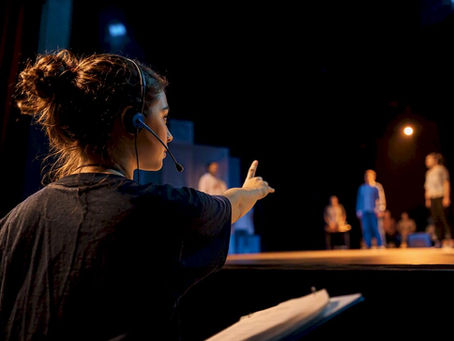 Teen stage manager calling rehearsal cues