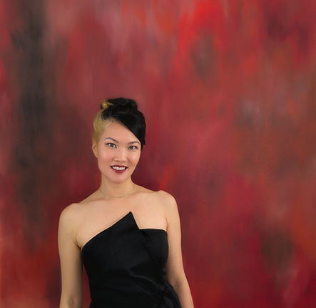 Headshot with painting Delia Hou_edited.jpg