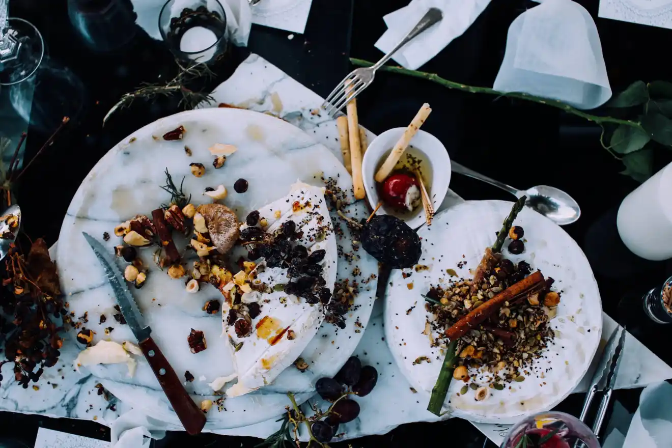 Stop Food Waste - plates with leftover food on table