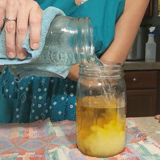 pouring water phase into oil phase making lotion