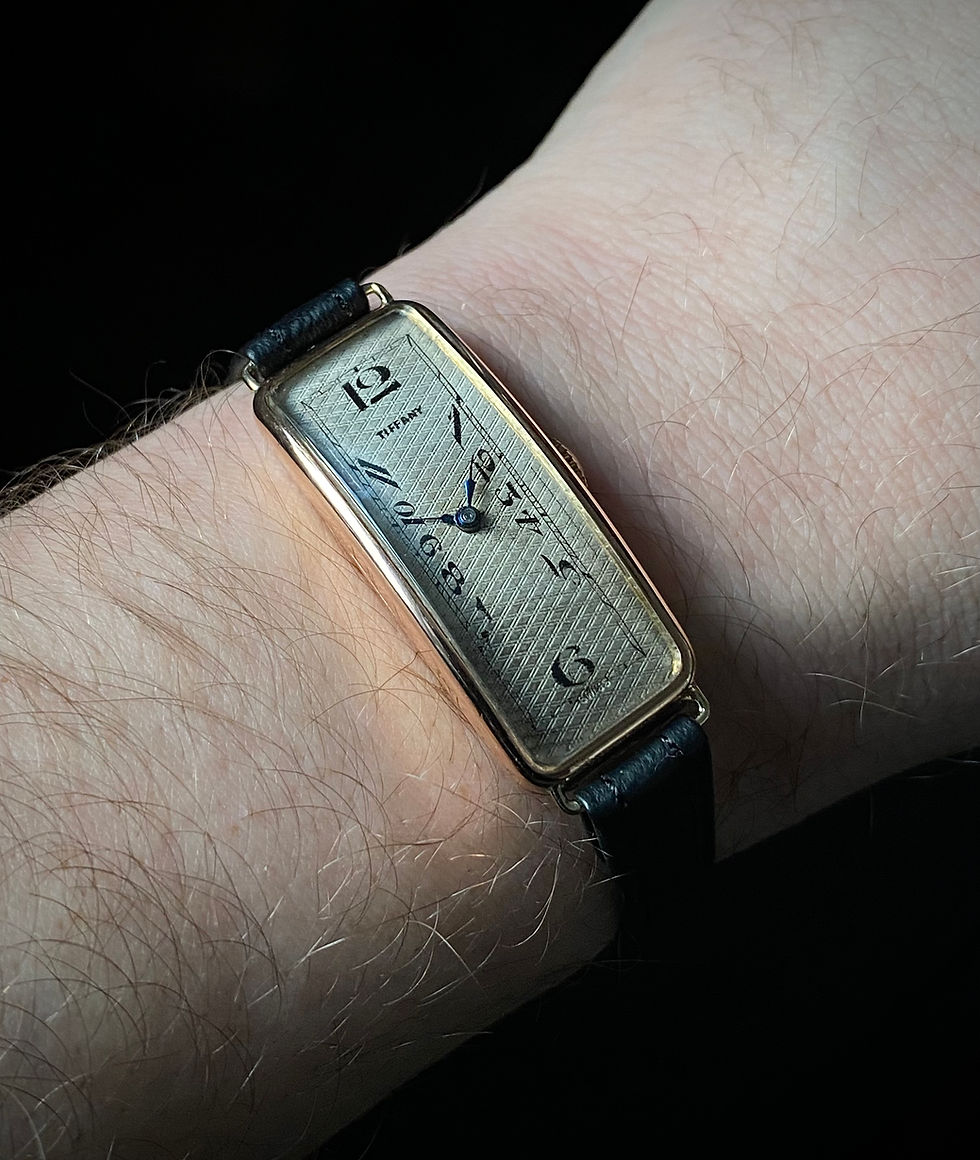 Thumbnail: 1929 Art Deco Tiffany silver dial exaggerated numerals 9k rose gold banana watch
