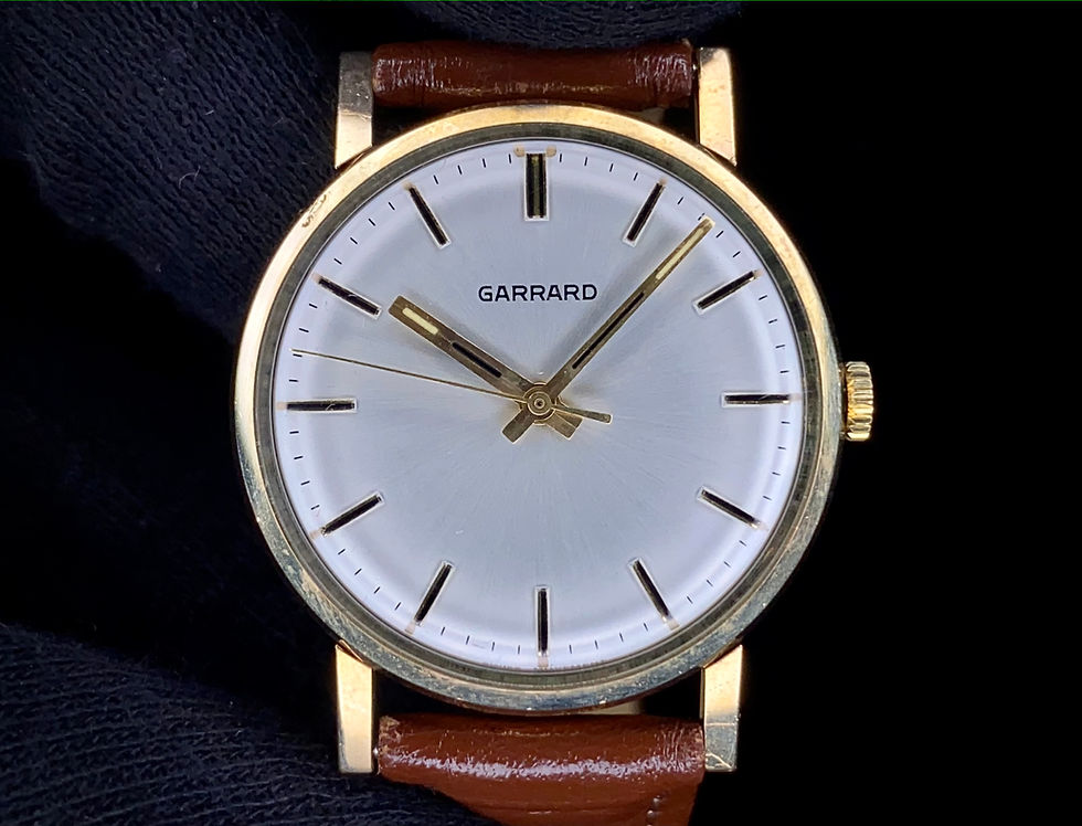 Thumbnail: 1980s Garrard 9ct gold circular dress watch sunburst dial ETA 2801-1 boxed paper