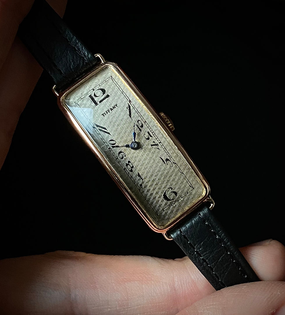 Thumbnail: 1929 Art Deco Tiffany silver dial exaggerated numerals 9k rose gold banana watch