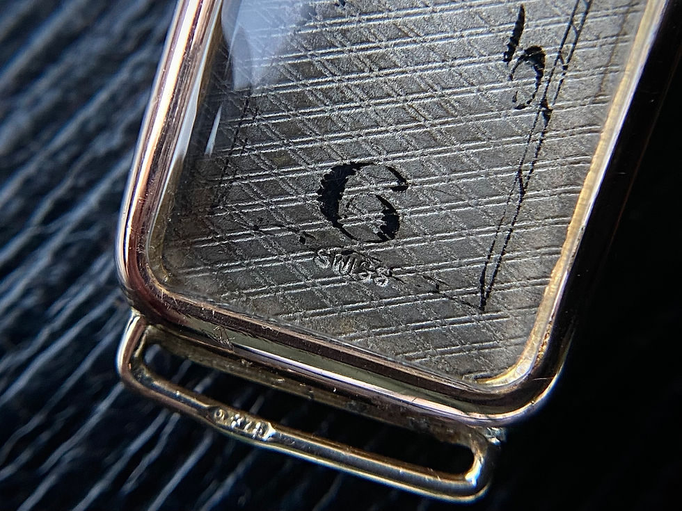 Thumbnail: 1929 Art Deco Tiffany silver dial exaggerated numerals 9k rose gold banana watch