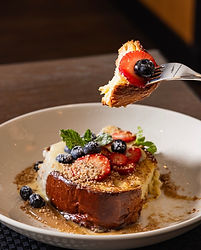 Waffles with strawberries and powdered sugar