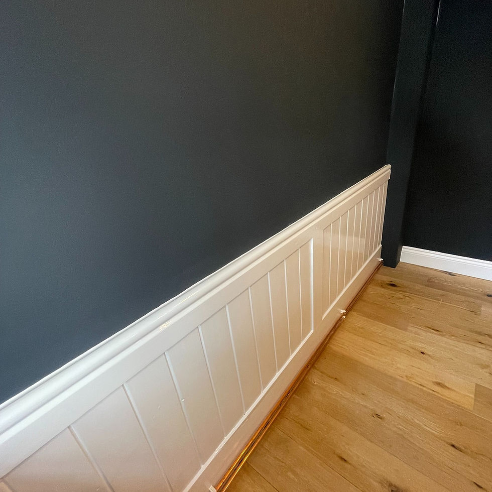 Crisp paint finish between dark wall and white panelled woodwork in Hadleigh