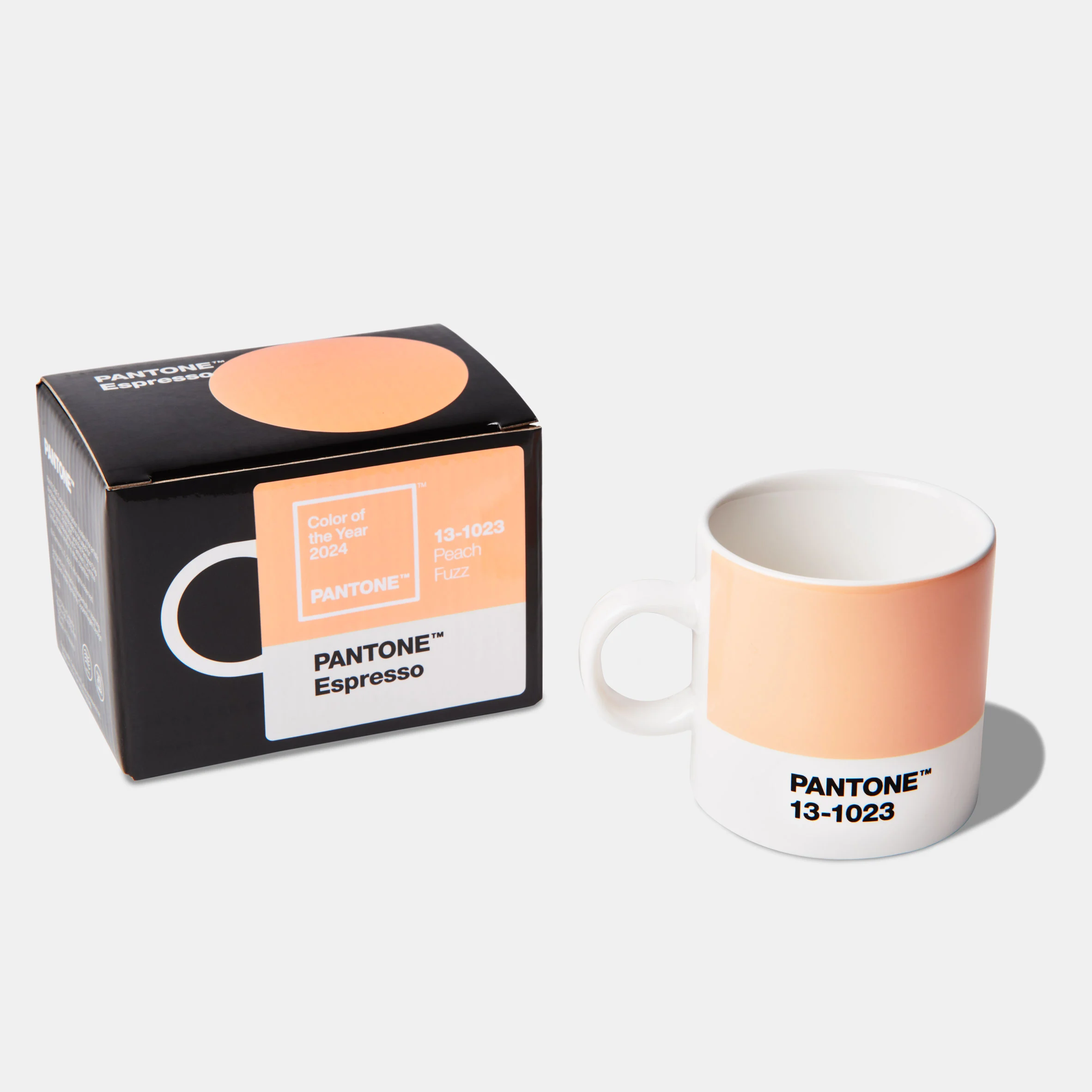 Image of the peach fuzz colour on a drinking mug