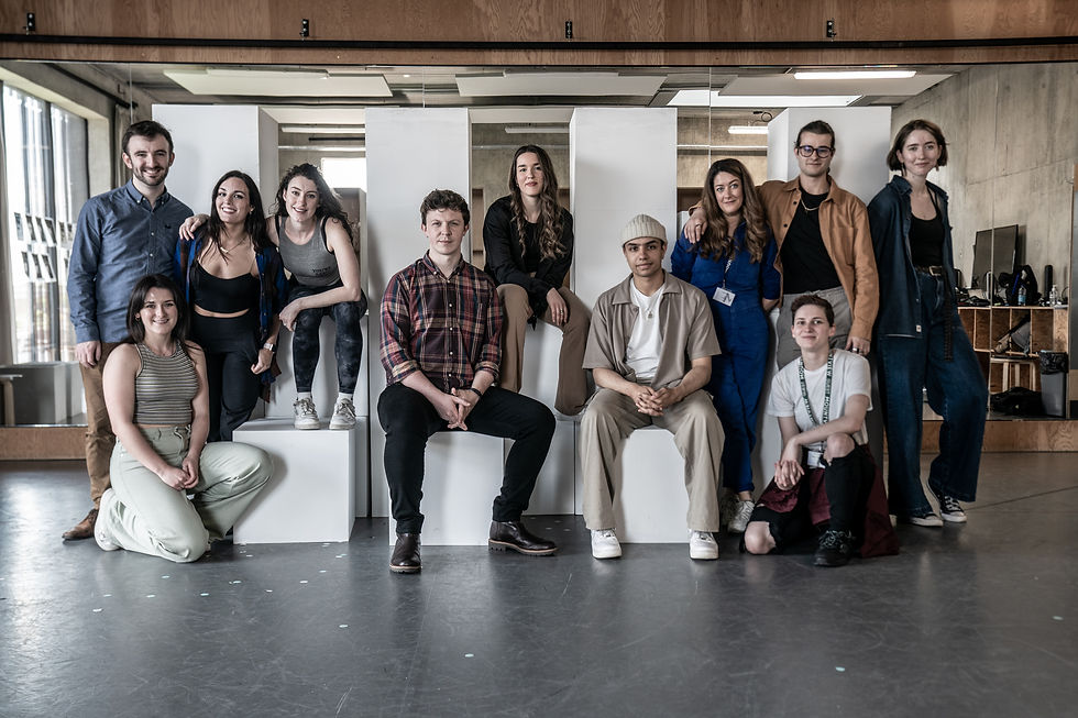The cast pose in a line