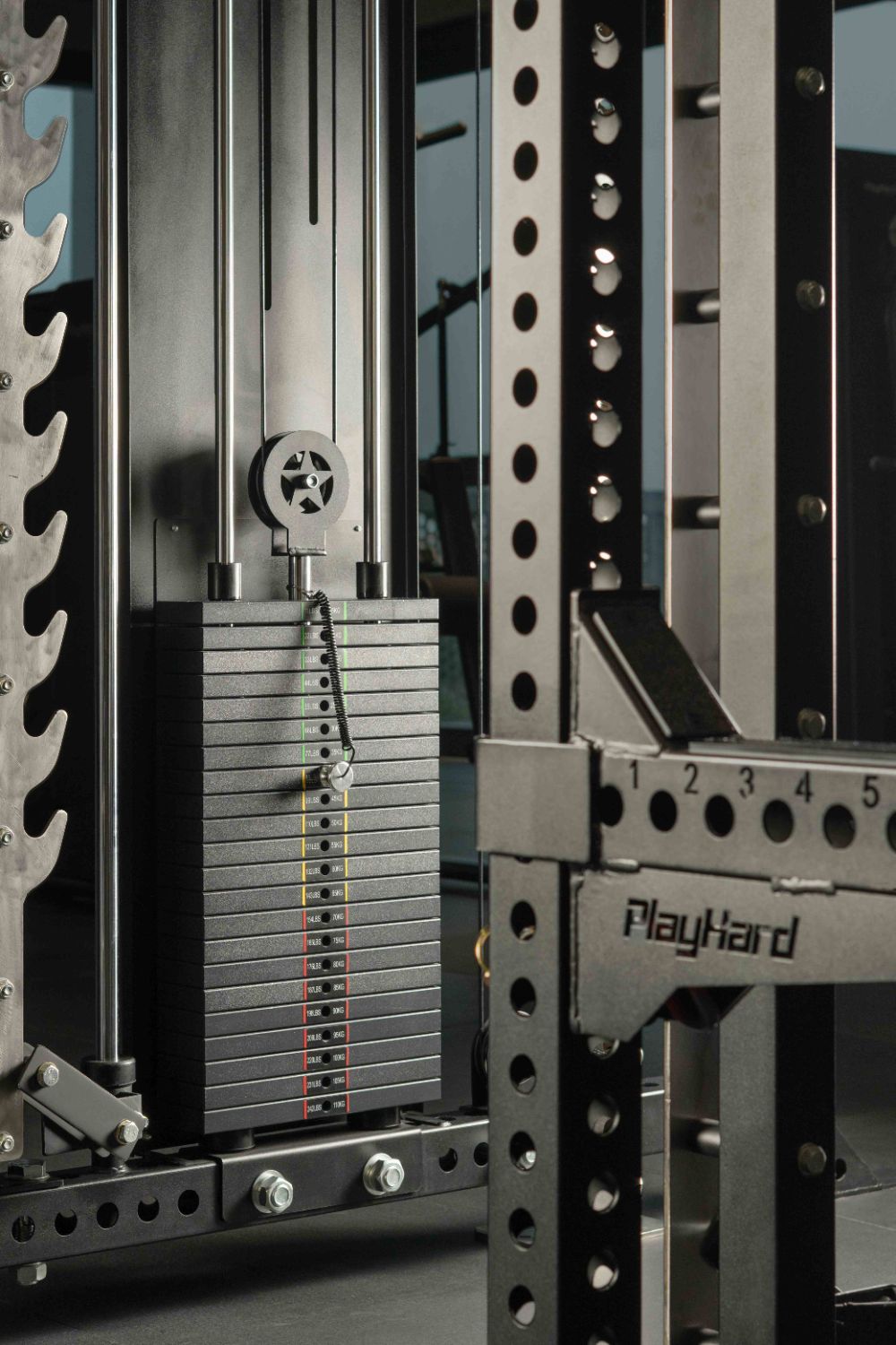 PlayHard rack and weight stack on the 8th-floor gym