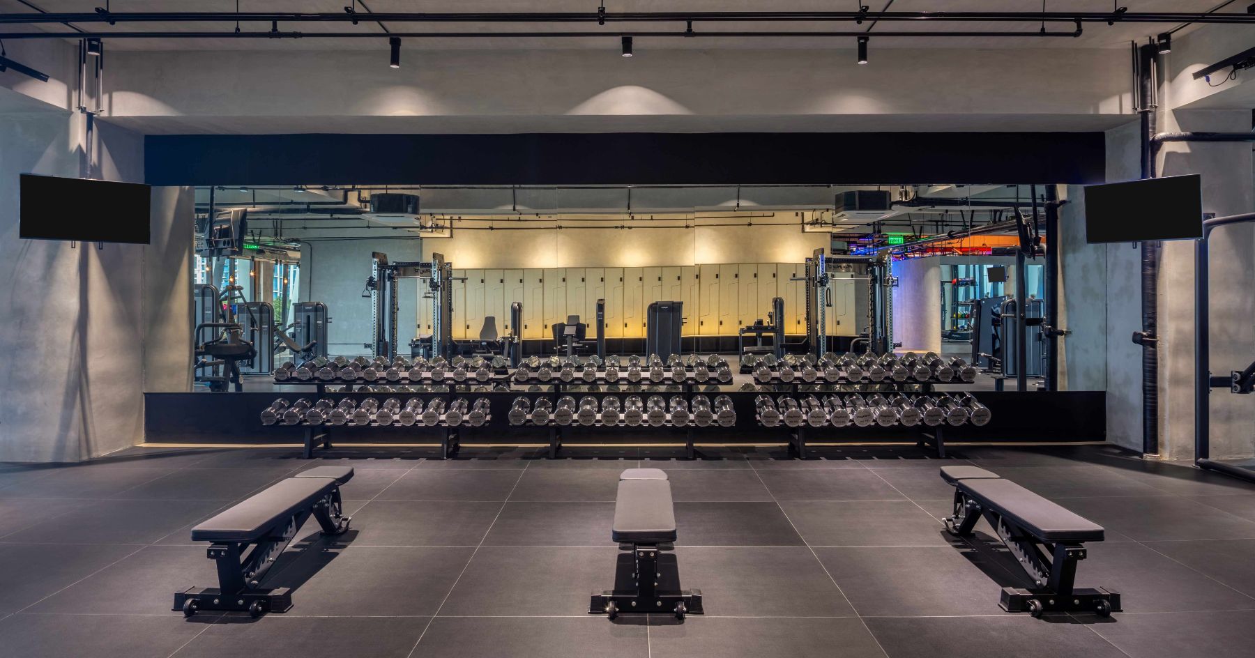 Dumbbells, benches and machines on the 8th-floor gym