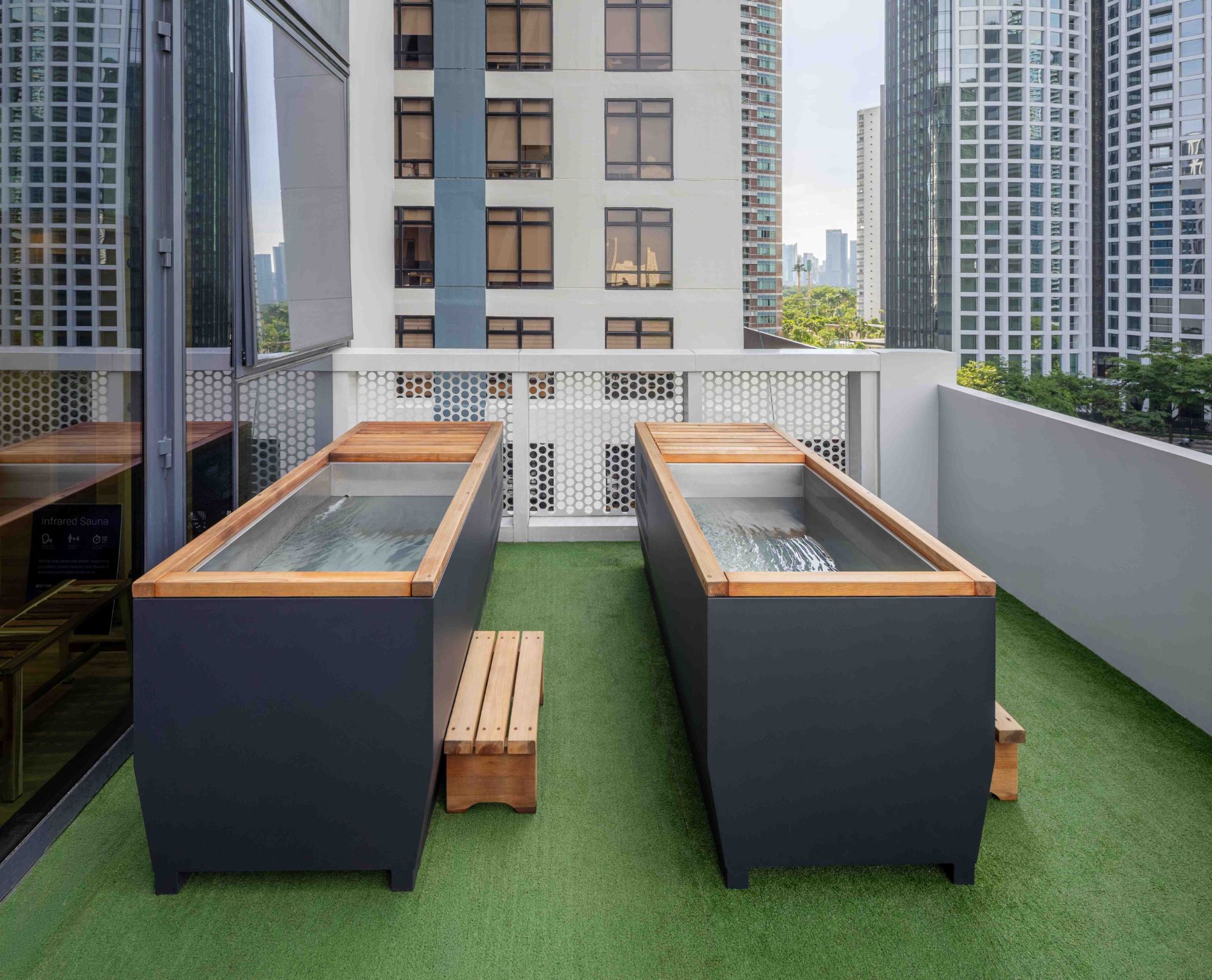 Two cold plunge tubs on the outdoor recovery deck