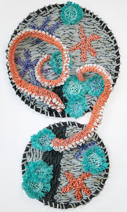 two octopus arms and a tidepool scene woven with reclaimed fishing rope