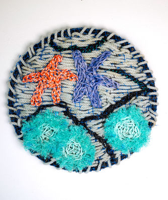 a crab ring woven with reclaimed fishing rope representing an Oregon coast tidepool
