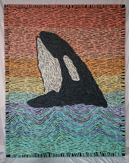 a breaching orca woven with reclaimed fishing rope