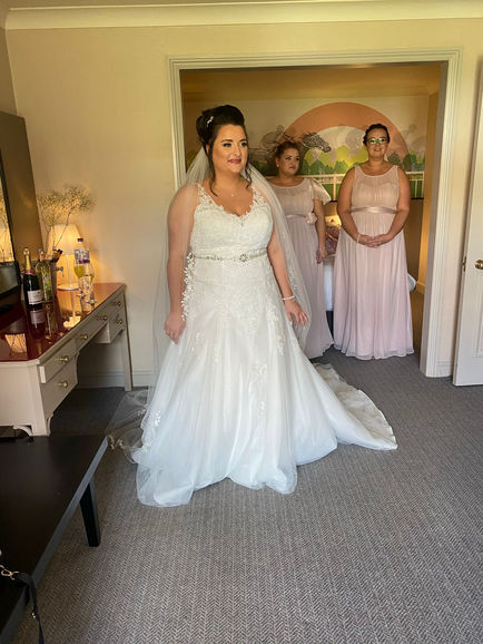 bride in dress with hair and makeup done