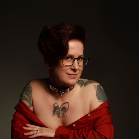 LGBT female posing on a chair