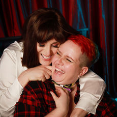 LGBT couple smiling and holding each other