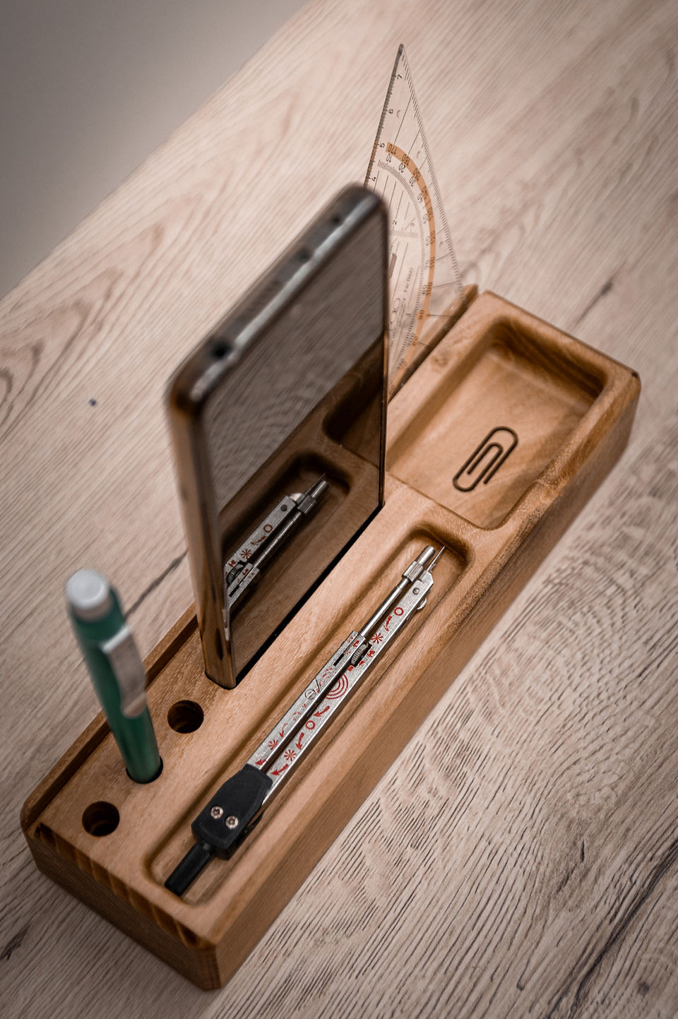 Wooden office organizer with telephone and writing utensils 
