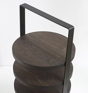 The Stack table in a version made out of walnut and black handle.