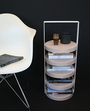 The Stack tables holds cups, books, magazines and devices.