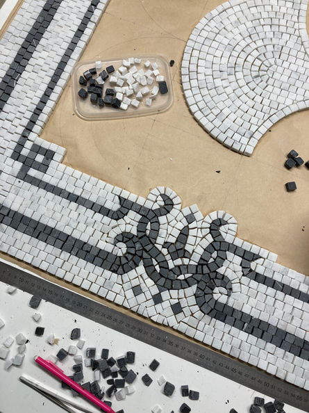 Detail of mosaic marble floor being fabricated by Corin Ashleigh Brown at London School of Mosaics