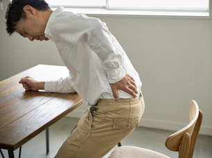 man grabbing low back in pain
