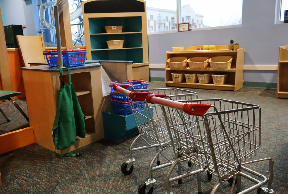 shopping cart and display items at museum