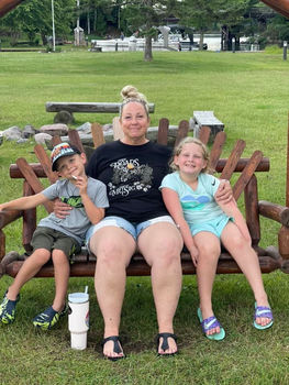 mom and kids at resort bench