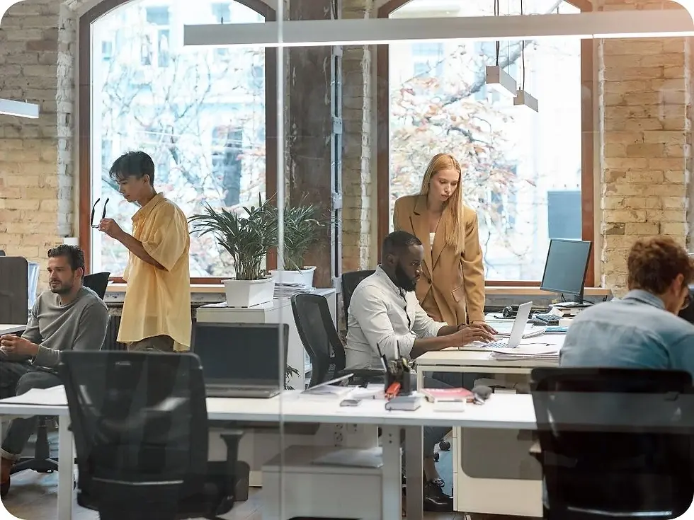 group of employees at a small business ready to scale in office