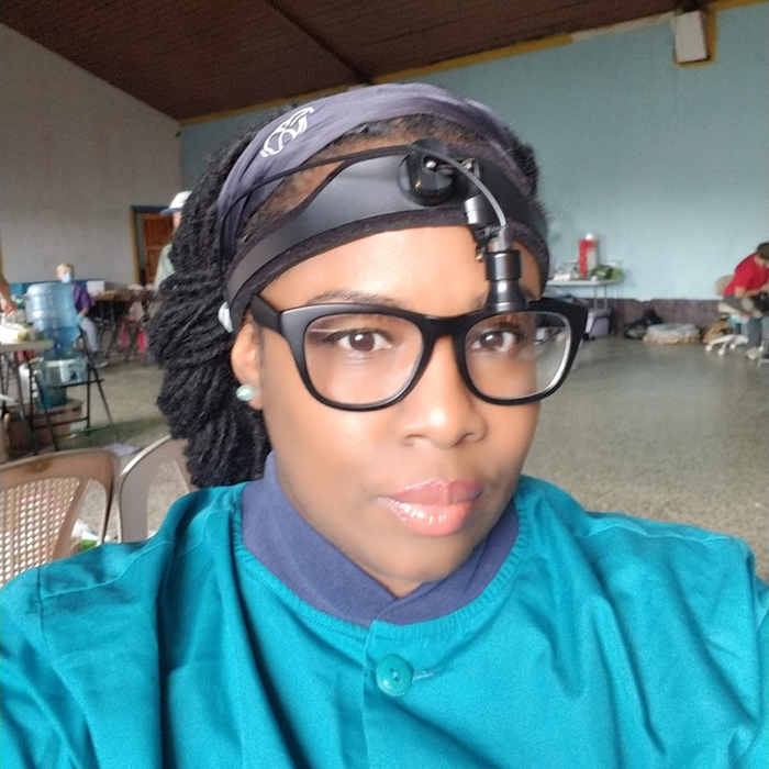 Healthcare worker in scrubs during community outreach