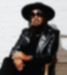 Stylish man in black hat, sunglasses, and leather jacket