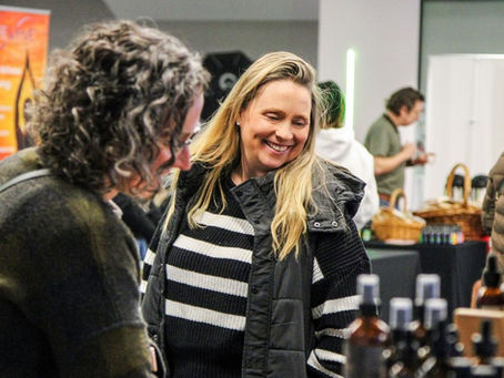 woman smiling at Holistic Health Fair