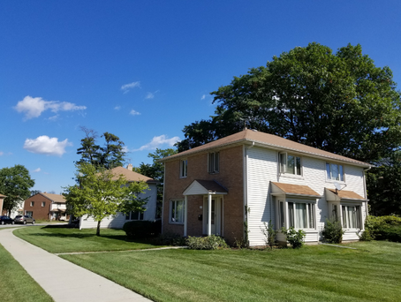 Ash Street Cooperative home on lush green street