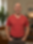 Smiling man in red shirt