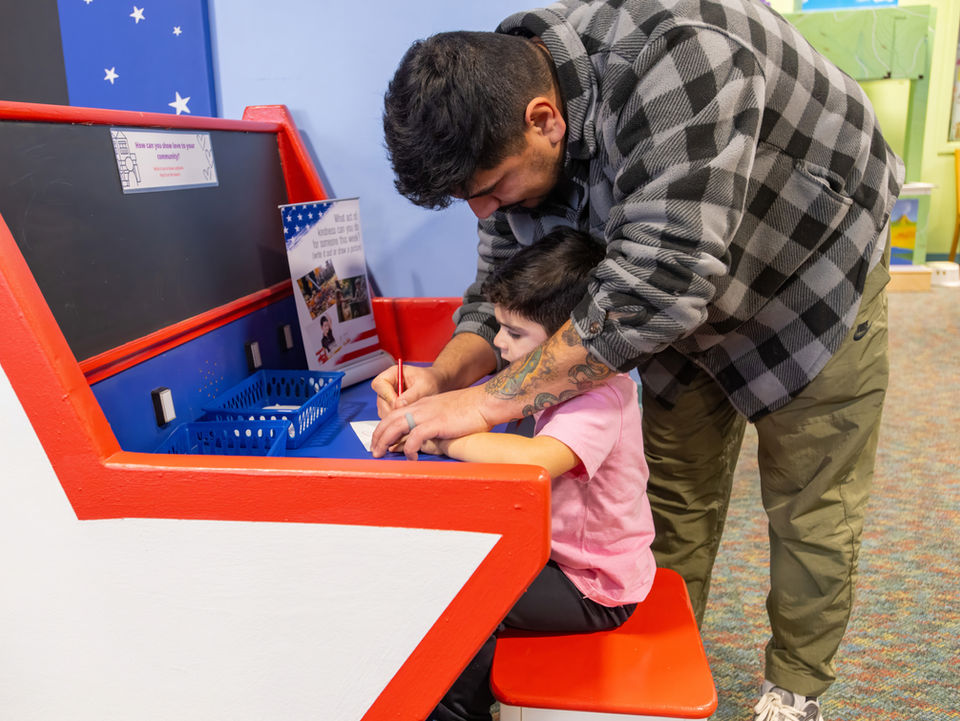 father showing child about the exhibit on 911