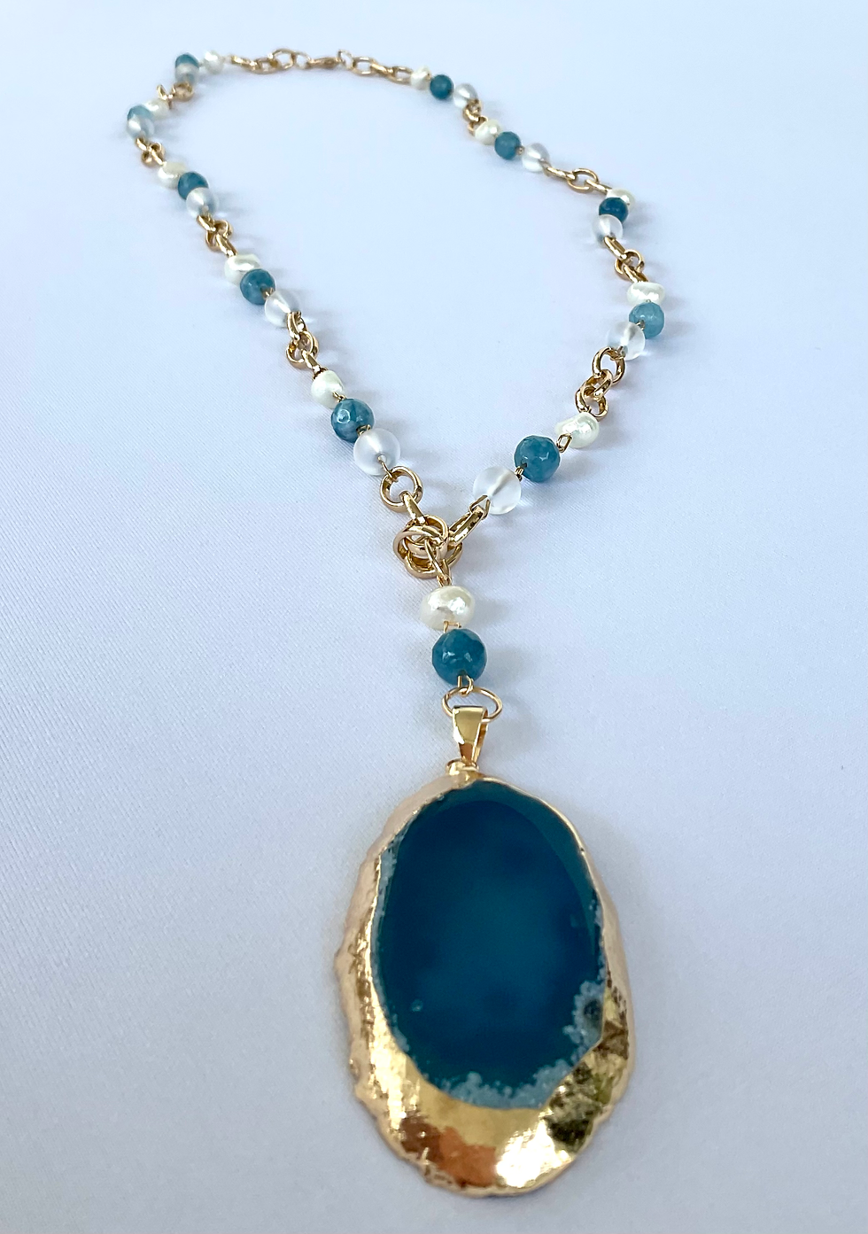 Thumbnail: Blue agate slice pendant necklace .