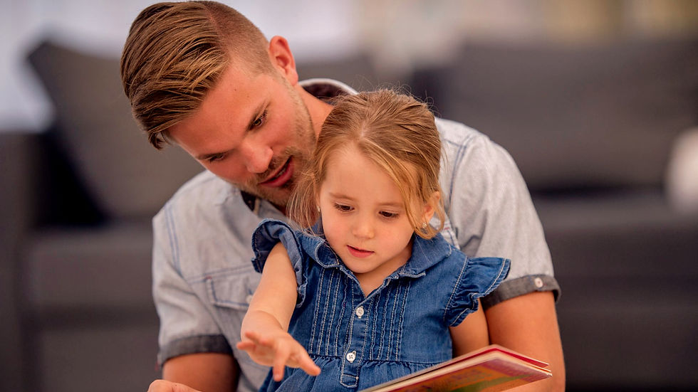 Eye-level view of a father reading a story to a child
