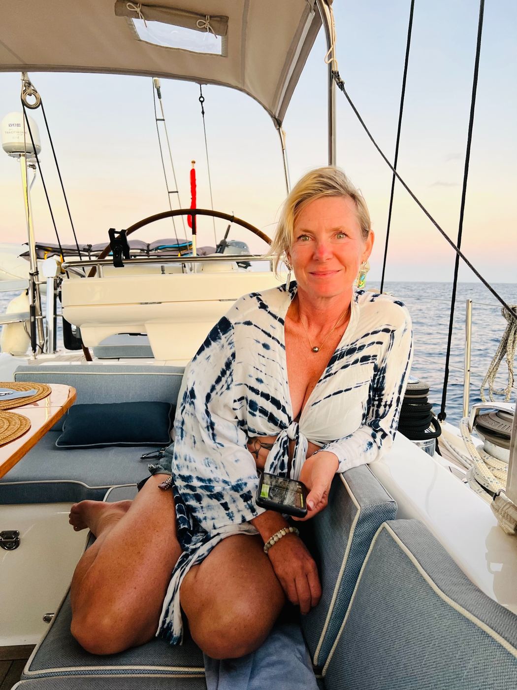 Susan aboard Makara in warm evening light