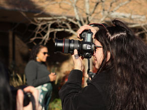Elaine Cromie photographs Brant Wells, senior WKAR director, at Michigan State University's Communication Arts and Sciences building on Wednesday, October 23, 2024, in East Lansing, MI. Cromie guides students as they create portaits of individuals participating in early voting or connected to Michigan State University - By Megan Basile