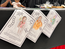 coloring book pages of Gordon Parks and Ethel Payne hang from table