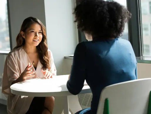 Women talking at table