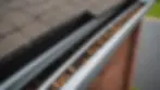 Eye-level view of a clean, well-maintained gutter system