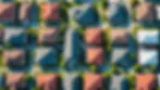 High angle view of a residential neighborhood highlighting multiple roofing styles and colors.