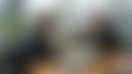 Executives discussing environmental report in office