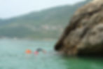 Swimming around a rock wall in the natural park of Arrabida