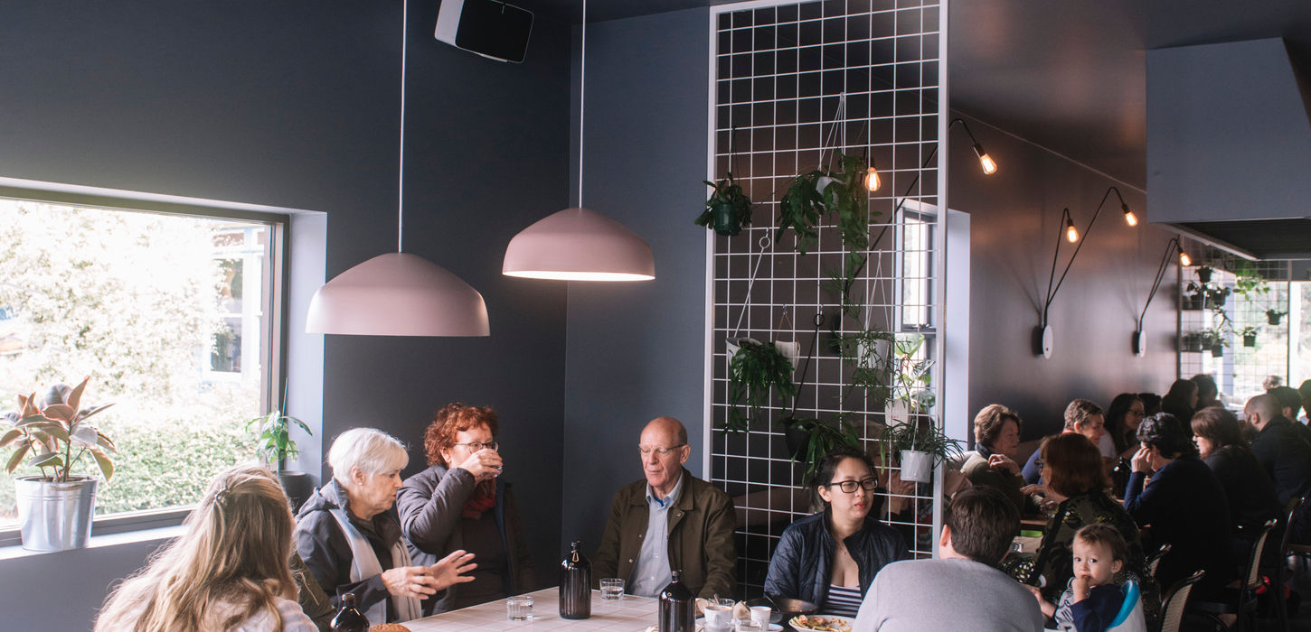 Communal dining area with people utilising space