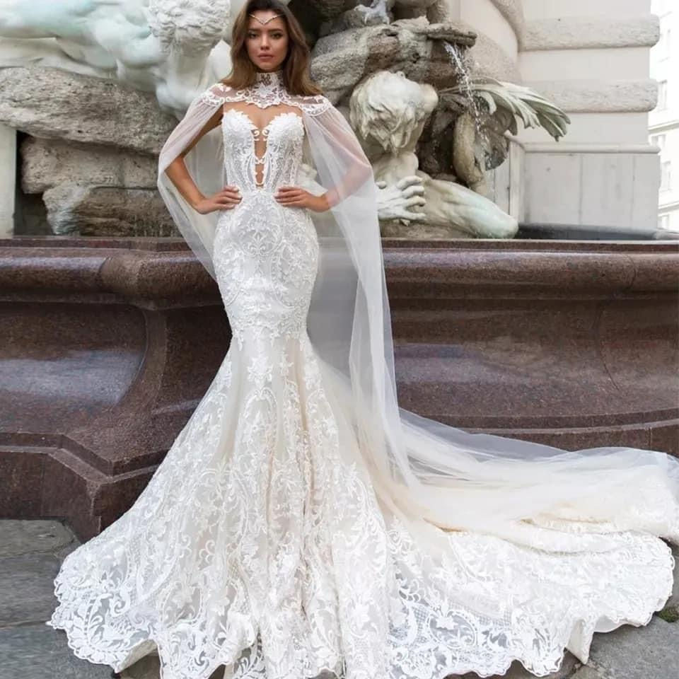 Thumbnail: Mermaid bridal gown with tulle V neck with cape. 
