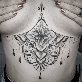 Ornamental sternum tattoo by Siarn Engels