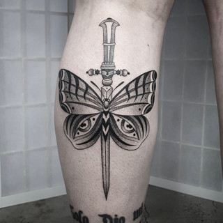 Butterfly and dagger tattoo by Siarn Engels